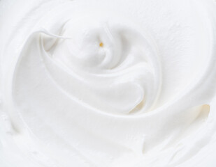 Creamy yoghurt swirled round close-up.