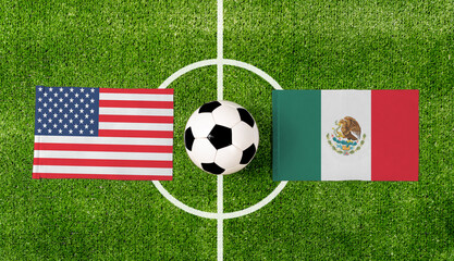 Top view soccer ball with USA vs. Mexico flags match on green football field.