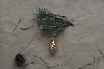 pine cones and Christmas decorations on a craft paper background. Christmas, winter, new year concept. Flat lay, top view, copy space