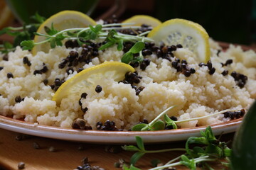 Couscous porridge with sprouts, sativa hemp seeds, lemon and wine