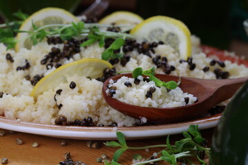 Couscous porridge with sprouts, sativa hemp seeds, lemon and wine