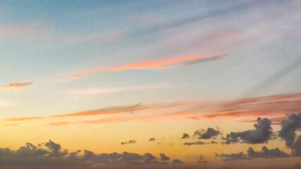Panoramic aerial view of sunset sky from flying drone.