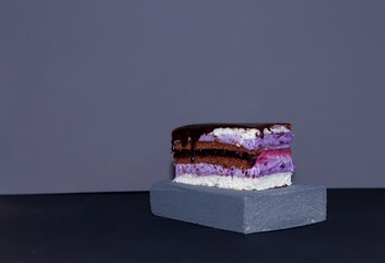 Blackberry cake. Flat design. Sweet dessert. premium recipes and offers. the cake is served on a wooden tray. a combination of the texture of a delicate cream cake and rough wood. copy space