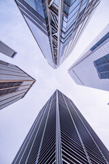 Looking up on to office skyscrapers, modern copy space backgrounds 