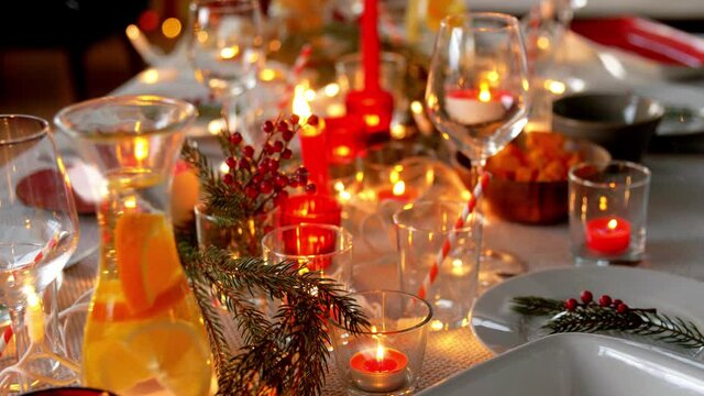 eating, winter holidays and celebration concept - table serving for christmas dinner party at home over snow