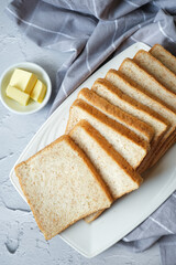 Whole wheat sandwich bread in white plate