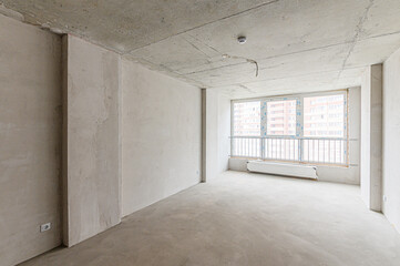 Russia, Moscow- May 04, 2020: interior room rough repair for self-finishing. interior decoration, bare walls of the premises, stage of construction