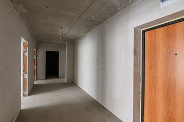 Russia, Moscow- May 04, 2020: interior room rough repair for self-finishing. interior decoration, bare walls of the premises, stage of construction