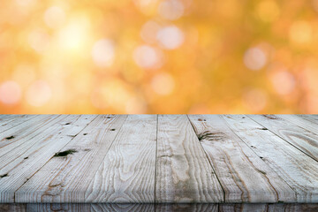 Empty wooden table top with autumn background.