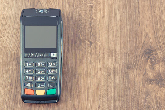 Credit card reader as device using for cashless paying. Payment terminal. Finance concept. Place for text
