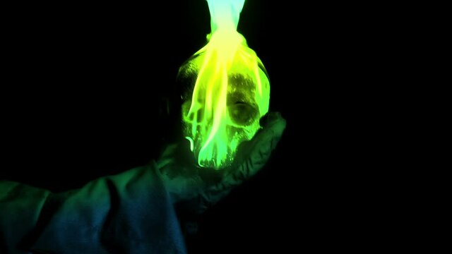 Sorcerer Throws Green Flaming Skull At Camera