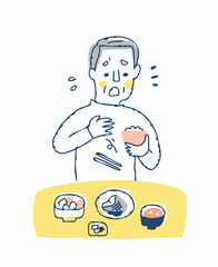 食事中に箸を落とすシニア男性