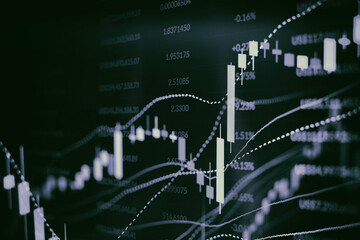 Close up financial chart with uptrend line graph in stock market on monitor background