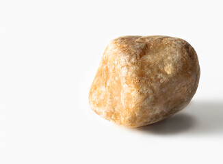 Dark yellow stone on a white background.