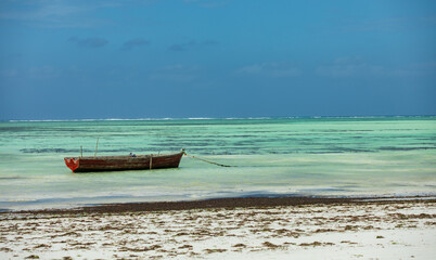 fishing boat on an empty Zanzibar beach