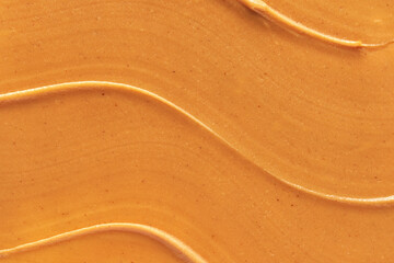 Obraz premium Peanut butter texture. Spread swirl. Organic keto food. Healthy creamy paste. Smooth closeup brown desert. Crunchy macro snack. Fat salt breakfast