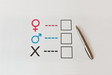 A person is determined by his gender. Sheet of paper with gender symbols. The right to one's identity.