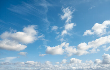 Naklejka na ściany i meble Clouds on a blue sky, natural cloudscape background.