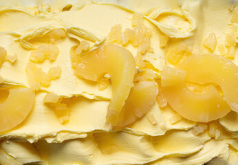 Frozen Pineapple flavour gelato - full frame detail. Close up of a yellow surface texture of Ice...