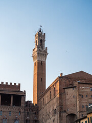 Fototapeta na wymiar Torre del Mangia Tower of the Palazzo Pubblico City Hall in Siena, Tuscany, Italy