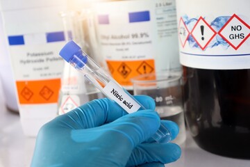 nitric acid in test tube used in laboratory