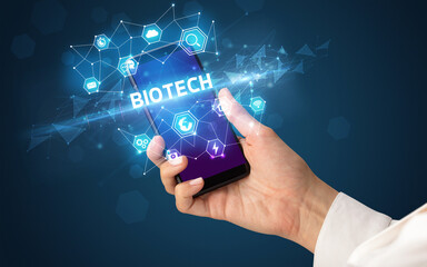 Hand using smartphone with technology concept