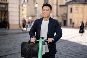 Asian businessman riding electric scooter on city street. Concept of modern city transportation....