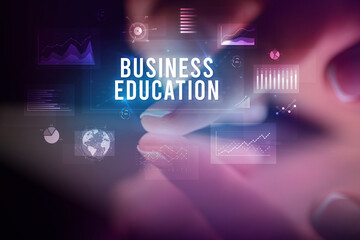 Finger touching tablet with business graphs and icons concept