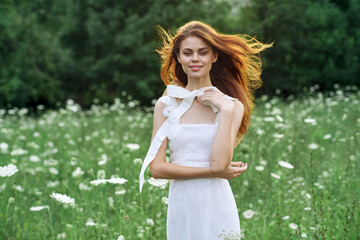 Woman in white dress in a field walk flowers vintage nature