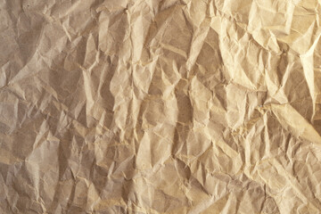Crumpled craft paper. Background from brown wrapping paper.