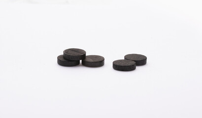 activated charcoal pills black on white background pills health adsorbent