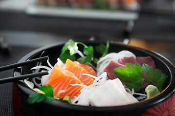 Sashimi is a Japanese dish that consists mainly of raw seafood or fish, finely cut, although not as much as a carpaccio. Served alongside a sauce and a simple dressing like grated daikon radish