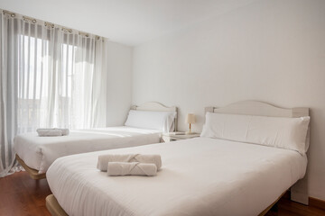 Bedroom with large single beds in a vacation rental apartment
