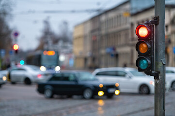 traffic light on the street junction with beautiful bokeh, city with cars in the background