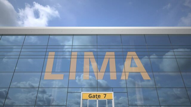 Airliner reflecting in the windows of airport terminal with LIMA text