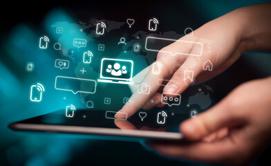 Close-up of a hand using tablet, social media concept
