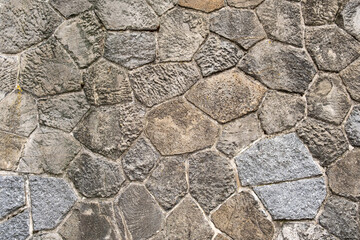 Gray stones cobblestones retro aged wall castle exterior near river in europe