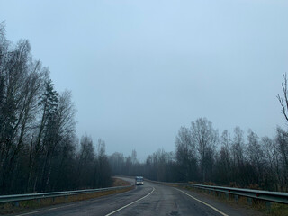 Fototapeta premium Empty road in the fog, gloomy mood