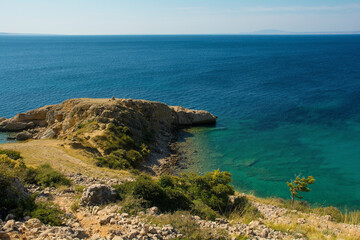 The rugged coastline north of Stara Baska in the south of Krk Island, in the Primorje-Gorski Kotar County of western Croatia in late summer
