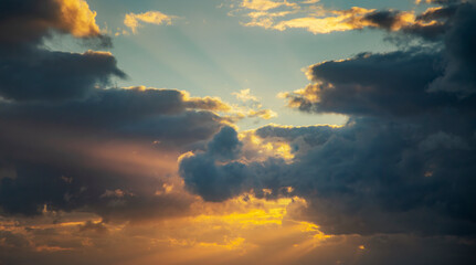 Dramatic sunset sky with orange rays of light