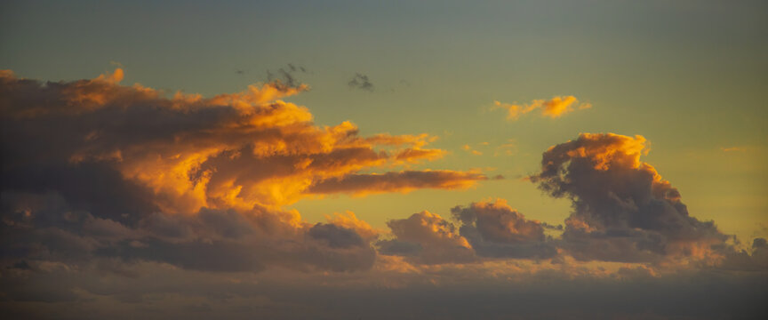 Sunset Cloudscape Panorama with wave shaped cloud formation © bartsadowski
