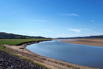 the river kent in cumbria with with the town of arnside in the distance