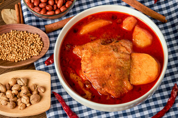 Chicken Massaman Curry on white bowl. Muslim curry or mussaman curry.  Muslim style chicken and potato or chicken mussaman curry.