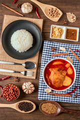 Chicken Massaman Curry on white bowl. Muslim curry or mussaman curry.  Muslim style chicken and potato or chicken mussaman curry.