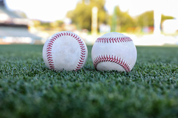Baseballs on grass