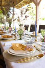 serving the festive table with decorative plates and forks and spoons