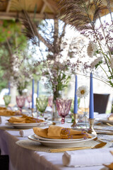 serving the festive table with decorative plates and forks and spoons