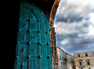 Heavy bronze door of the cathedral San Nicola Pellegrino at Trani, Italy