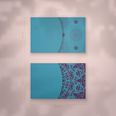 Business card in turquoise color with purple mandala ornament for your brand.