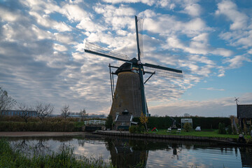 Ancient windmill on the edge of the canal at Kinderdijk, Netherlands